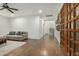 Bright hallway featuring wood floors, stairway and an decorative wooden grid wall at 2701 E Hobart St, Gilbert, AZ 85296