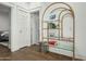 Hallway featuring a decorative shelf with glass shelves and a view of the bedroom at 2701 E Hobart St, Gilbert, AZ 85296