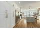 Spacious kitchen featuring white cabinetry, stainless steel appliances, and wood flooring at 2701 E Hobart St, Gilbert, AZ 85296