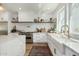 Charming kitchen featuring a farmhouse sink, stainless steel range, and bright windows at 2701 E Hobart St, Gilbert, AZ 85296