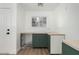 Kitchenette area features butcher block countertops, sage-colored cabinets, and a stainless-steel sink at 2701 E Hobart St, Gilbert, AZ 85296