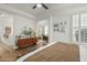 Stylish bedroom with light hardwood floors and a glimpse into adjacent rooms at 2701 E Hobart St, Gilbert, AZ 85296