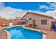 Backyard featuring private pool, patio and desert landscaping at 2704 E Anderson Dr, Phoenix, AZ 85032