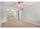 Bedroom featuring neutral walls, carpet, mirrored closet doors and ceiling fan at 2704 E Anderson Dr, Phoenix, AZ 85032