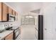 Kitchen featuring stainless steel appliances, wood cabinets, tile flooring, and natural light with an eat-in breakfast nook at 2704 E Anderson Dr, Phoenix, AZ 85032