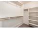 Ample storage in this walk-in closet with built-in shelving and hanging rods at 2704 E Anderson Dr, Phoenix, AZ 85032