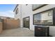 Small backyard with gravel and a block wall fence, sliding door, and modern home exterior at 2818 W Eagle Talon Rd, Phoenix, AZ 85085