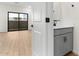 Modern bathroom featuring wood-look floors and a sleek gray vanity at 2818 W Eagle Talon Rd, Phoenix, AZ 85085