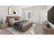 This bedroom features neutral walls, carpet flooring, a window for natural light, and a minimalistic design at 2818 W Eagle Talon Rd, Phoenix, AZ 85085