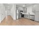 A modern kitchen with stainless steel appliances and gray cabinets in a bright, open space at 2818 W Eagle Talon Rd, Phoenix, AZ 85085