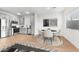 A view of an open-concept kitchen and dining area with modern decor at 2818 W Eagle Talon Rd, Phoenix, AZ 85085