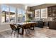 Lovely dining room has wood look tile floor and stylish modern light fixture at 30331 N 115Th Ln, Peoria, AZ 85383