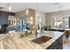 Spacious kitchen features marble countertops, stainless sink and pendant lights at 30331 N 115Th Ln, Peoria, AZ 85383