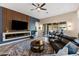 Relaxing living room includes blue accent wall and a modern electric fireplace at 30331 N 115Th Ln, Peoria, AZ 85383