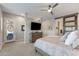 Tranquil main bedroom has stylish barn door, neutral walls, and carpet floor at 30331 N 115Th Ln, Peoria, AZ 85383