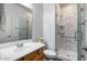 Well-lit bathroom featuring a walk-in shower with marble surround and modern fixtures at 3419 W Thoreau Ln, Anthem, AZ 85086