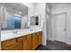 Bathroom featuring double sinks, large mirror, and stylish vanity, providing ample space at 3419 W Thoreau Ln, Anthem, AZ 85086