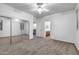 Bedroom with neutral carpet and mirrored closet doors providing a sense of depth at 3419 W Thoreau Ln, Anthem, AZ 85086