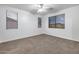 Bedroom with neutral carpet, ceiling fan, and great natural light, ready for customization at 3419 W Thoreau Ln, Anthem, AZ 85086