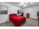 Cozy bedroom with a ceiling fan, window, and furniture at 3419 W Thoreau Ln, Anthem, AZ 85086