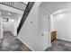 Bright entryway featuring staircase with black railings and tile flooring leading to the upper level at 3419 W Thoreau Ln, Anthem, AZ 85086