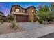 Charming two-story home featuring a tile roof and a spacious two-car garage at 3419 W Thoreau Ln, Anthem, AZ 85086