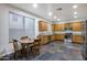 Well-lit kitchen with stainless steel appliances, granite countertops and casual dining area at 3419 W Thoreau Ln, Anthem, AZ 85086