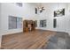 Bright living room with high ceilings, large windows, and hardwood floors at 3419 W Thoreau Ln, Anthem, AZ 85086