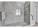 Sleek walk-in shower featuring gray tile and glass enclosure at 3504 E Boot Track Trl, Gilbert, AZ 85296