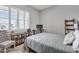 Cozy bedroom featuring a metal bed frame and a window with plantation shutters that offer ample natural light at 3504 E Boot Track Trl, Gilbert, AZ 85296