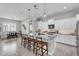 Stylish kitchen island features bar seating and granite countertops, perfect for entertaining at 3504 E Boot Track Trl, Gilbert, AZ 85296