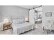 Serene main bedroom featuring a sliding barn door to a luxurious ensuite bathroom at 3504 E Boot Track Trl, Gilbert, AZ 85296