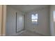 Bright bedroom with a closet, a large window offering natural light, and views of the surroundings at 37626 N Cowboy Ln, San Tan Valley, AZ 85140