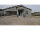 Exterior view of a new build with a two-car garage, stone accents, and a covered front entryway at 37626 N Cowboy Ln, San Tan Valley, AZ 85140