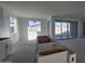 Spacious kitchen area with white cabinets and center island awaiting finishing touches in a modern, light-filled space at 37626 N Cowboy Ln, San Tan Valley, AZ 85140