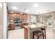 Bright kitchen featuring stainless steel appliances, granite countertops and kitchen island at 3790 S Velero St, Chandler, AZ 85286