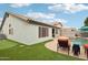 Beautiful backyard featuring a sparkling pool, putting green, and comfortable patio furniture at 3793 S Seton Ave, Gilbert, AZ 85297