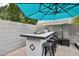 The backyard bar offers a modern design with bar seating and a diamond backsplash at 3793 S Seton Ave, Gilbert, AZ 85297