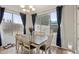 Dining room with a table, six chairs, and large window at 3793 S Seton Ave, Gilbert, AZ 85297