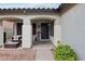 Covered front porch with seating area and front door at 3793 S Seton Ave, Gilbert, AZ 85297