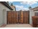 Wooden gate with metal framing and concrete block columns at 3793 S Seton Ave, Gilbert, AZ 85297