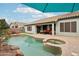 Wonderful backyard with a pool, hot tub, covered patio, and orange lounge chairs perfect for relaxing at 3793 S Seton Ave, Gilbert, AZ 85297