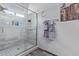 Bright bathroom featuring a glass enclosed shower with stylish tiling and fixtures at 3907 N 143Rd Ln, Goodyear, AZ 85395