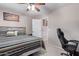 Stylish bedroom featuring a ceiling fan, and desk, creating a relaxing space at 3907 N 143Rd Ln, Goodyear, AZ 85395