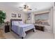 Comfortable bedroom featuring a ceiling fan, window, and neutral walls, creating a relaxing space at 3907 N 143Rd Ln, Goodyear, AZ 85395