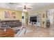 Inviting living room featuring a cozy sectional sofa and stylish decor at 3907 N 143Rd Ln, Goodyear, AZ 85395