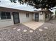 Low-maintenance backyard featuring decorative rock, a patio, and privacy features at 4026 E Catalina Cir, Mesa, AZ 85206