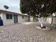 Low-maintenance backyard with decorative rock, a producing orange tree, and a privacy wall at 4026 E Catalina Cir, Mesa, AZ 85206