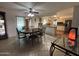 Sunlit dining area boasts an adjacent kitchen with a breakfast bar, ideal for entertaining guests at 4026 E Catalina Cir, Mesa, AZ 85206