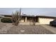 Charming single-story home with low maintenance rock landscaping and attached two car garage at 4026 E Catalina Cir, Mesa, AZ 85206